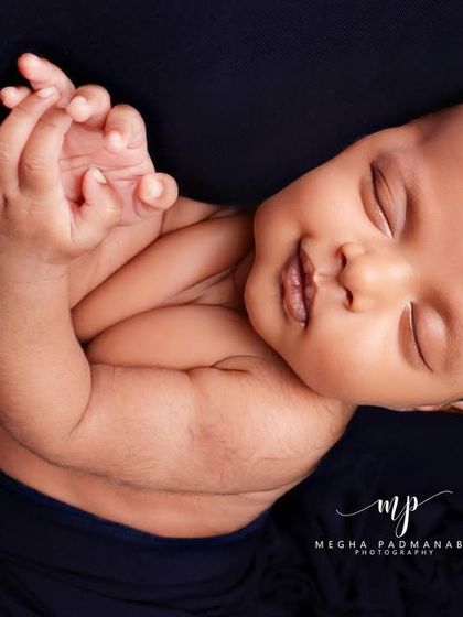 A beautiful, sleepy smile. These are the candid moments that make each newborn session so special.