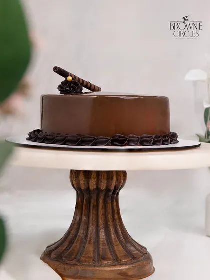 This is my classic Chocolate Truffle Cake, a favorite for any celebration. I use only pure couverture chocolate for that deep, rich flavor, layered with a moist sponge and a glossy ganache finish. It’s elegance you can taste.