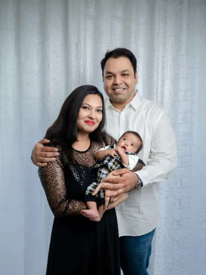 A classic family portrait with a newborn, filled with smiles and love. We help pose your family to create timeless images you can proudly display.