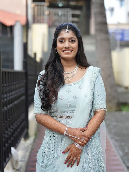 A classic portrait of the bride on her reception day. The makeup is subtle and enhances her features, creating a timeless look that she will love for years to come.
