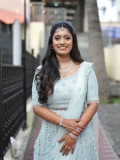 A classic portrait of the bride on her reception day. The makeup is subtle and enhances her features, creating a timeless look that she will love for years to come.