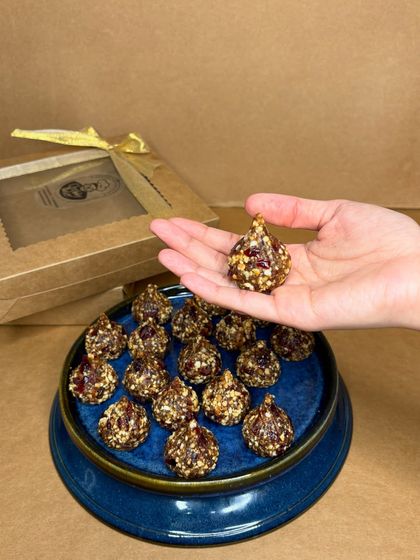 This is my Peanut & Cranberry Modak, a healthy and festive treat. Shaped traditionally, this energy ball is vegan, gluten-free, and made with pure, raw ingredients without any added sugar.