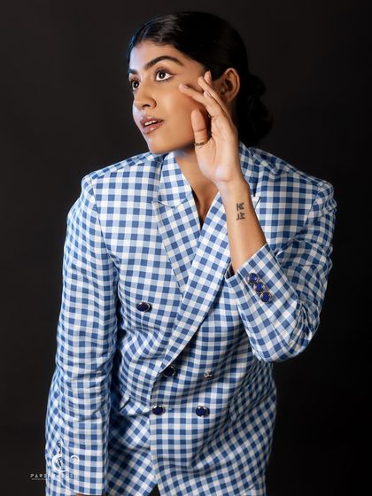 A candid, thoughtful glance away from the camera. This portrait feels natural and unposed, capturing a quiet moment of reflection.