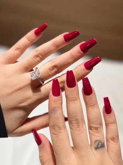 You can never go wrong with a classic, powerful red. This set features long, coffin-shaped nails with a super glossy, deep red gel polish for a look that is both timeless and a total head-turner.