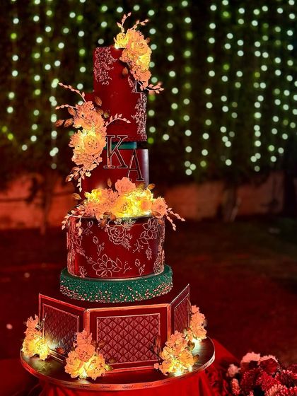The scale of this wedding cake was truly grand, with multiple tiers and a custom quilted base.