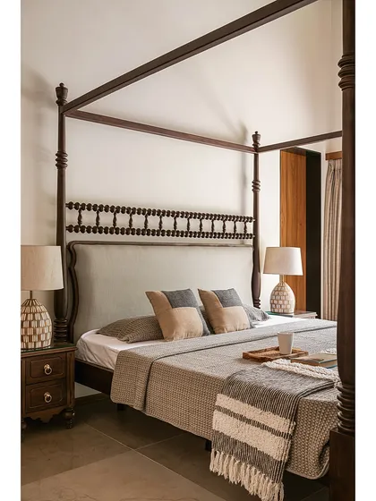 These bespoke wardrobes blend a soft, powdery grey with warm oak. The oversized circular wooden pulls act as modern Kolam-inspired strokes, adding a graphic and tactile detail to the minimalist design.
