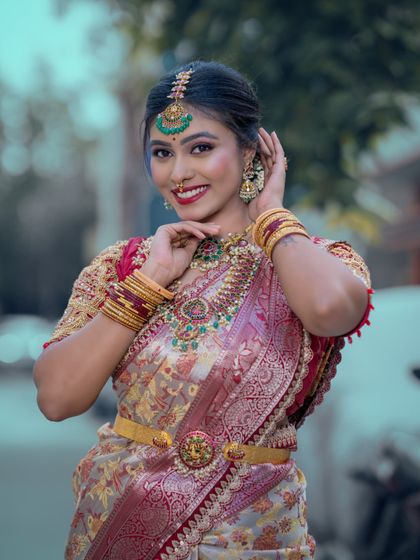 This bride is glowing with happiness. I created a look with rosy cheeks and a bright smile, using makeup to highlight her joy on her special day. The look is paired with a beautiful floral printed silk saree.