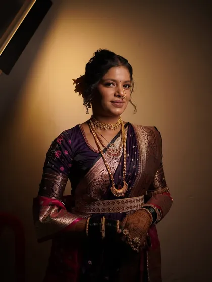 Another beautiful shot of the bride's engagement look. The lighting highlights her features and the beautiful embroidery on her blouse.