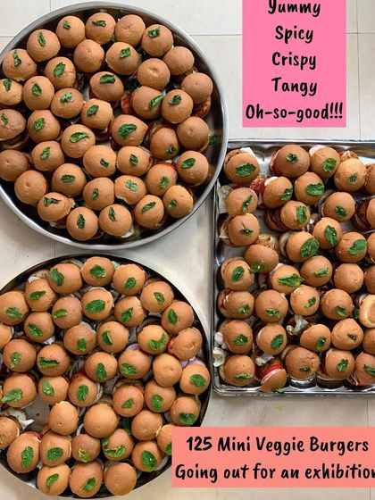 An order of 125 Mini Veggie Burgers going out for an exhibition. They are yummy, spicy, crispy, and tangy.