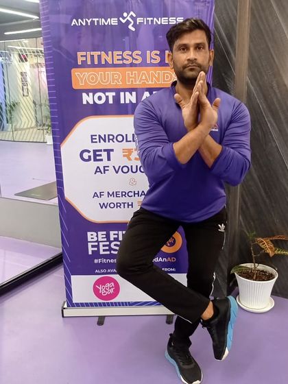 This participant demonstrates a modified Eagle Pose, showing how we adapt exercises for everyone.