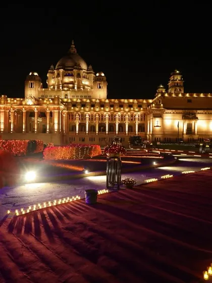 Against the majestic backdrop of Umaid Bhawan Palace, I designed a grand entrance path lined with hundreds of candles, creating a glimmering walkway fit for royalty.