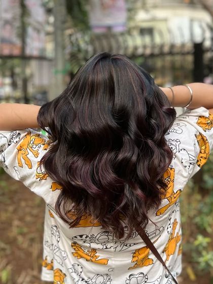 Our Cherry Choco balayage blend. This look combines deep chocolate tones with hints of cherry red for a subtle yet playful effect.