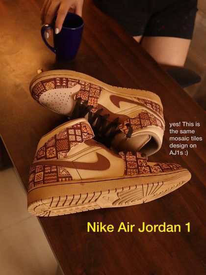 Here’s another look at the mosaic tile design, this time on a pair of Nike Air Jordan 1s. The coffee-dyed base really makes the earthy tones of the Persian and Portuguese-inspired patterns stand out.