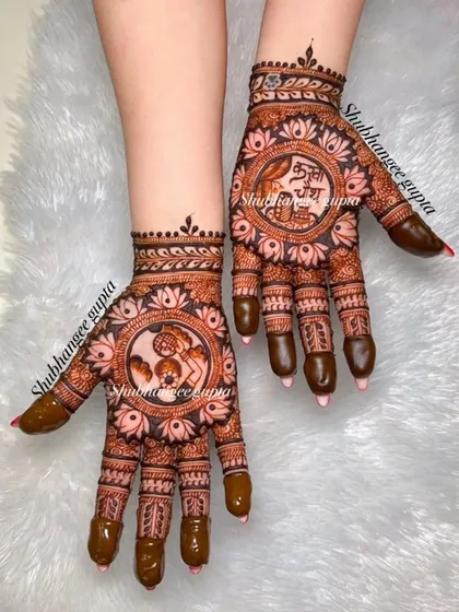 Getting you ready for festive celebrations like Karwachauth. This design features the traditional scene of a woman looking at the moon through a sieve, surrounded by beautiful floral patterns.