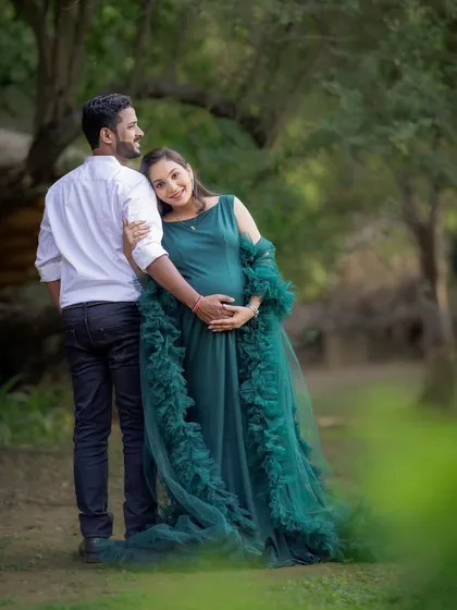 A quiet moment of connection, with the mom-to-be leaning back into her partner's embrace. These are the simple, beautiful memories I aim to capture.