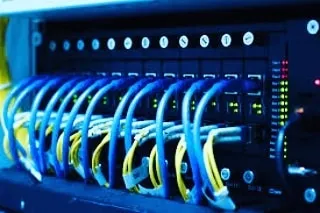 A close-up of a network switch after setup, with all connections active and running smoothly. We make sure everything is tested and working perfectly.