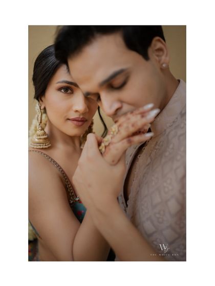 A tender moment captured beautifully. The focus is on the couple's connection, with the makeup enhancing the bride's natural beauty.