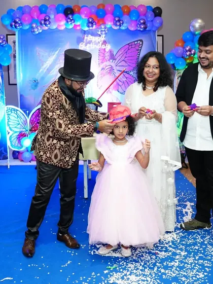The birthday girl gets to be the magician. I guide her and her parents through a fun trick, creating a wonderful family memory at her party.