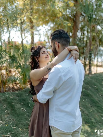 An embrace that says more than words ever could. This pre-wedding photo captures the couple's deep connection and the serene beauty of their natural surroundings.