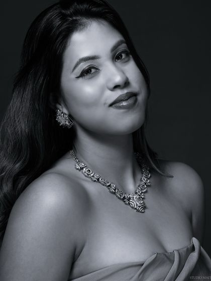 A smiling black and white portrait, capturing a moment of joy.