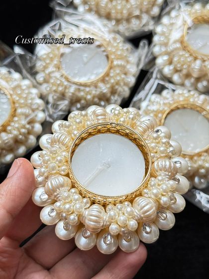 A classic and elegant choice, this pearl-encrusted T-light holder adds a touch of sophistication to any setting, festive or otherwise.