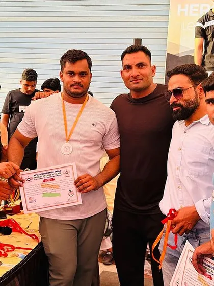 Another shot from the awards ceremony with my teammates. The support of a strong team is crucial.
