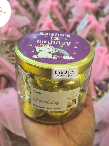 A jar of our handmade chocolates, wrapped in gold foil and sealed with a personalized unicorn sticker. It's these little details that make a hamper truly special.