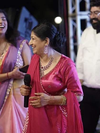 A candid shot of a family member giving a heartfelt speech during the Sangeet, capturing the genuine emotions of the evening.