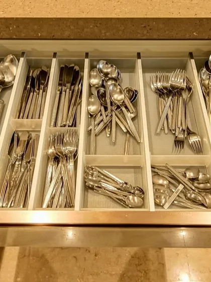 This cutlery tray from our C-shaped acrylic kitchen project demonstrates how we prioritize organization down to the smallest detail.