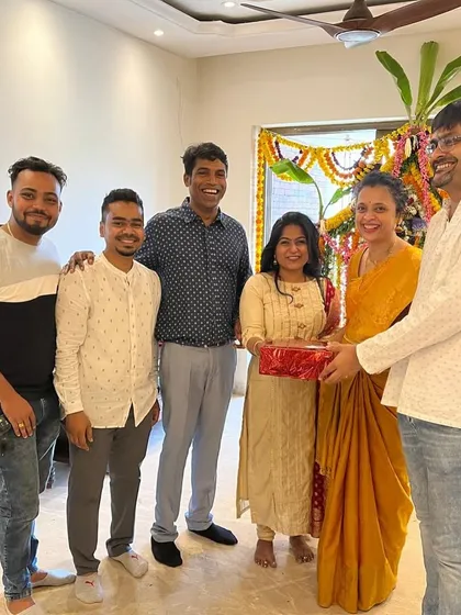 Our team celebrating with another happy family. We believe in building relationships as strong as the homes we design.