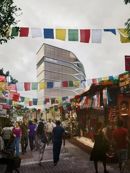 A street view montage of the Hilton Kathmandu, framed by traditional prayer flags. This image illustrates our goal of creating architecture that resonates with its cultural context.