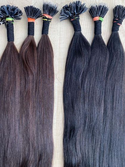 A side-by-side comparison of different colored I-Tip extensions, showing the range available for perfect color matching.