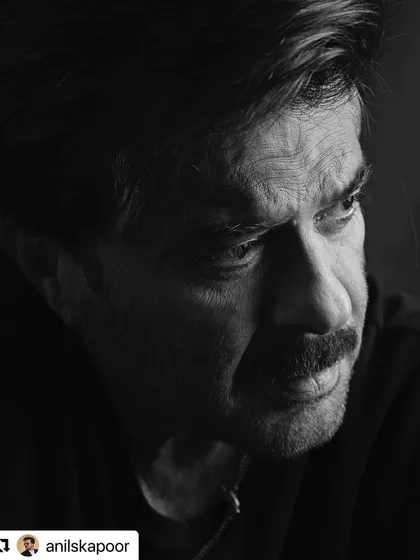 A pensive, close-up shot where the hair frames his face perfectly.