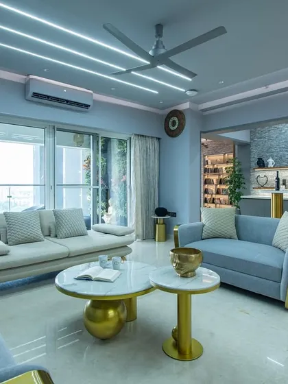 There’s something about this space that makes you want to sit down and exhale. Rich blue tones, soft lighting, and luxurious textures do all the talking in this SNN Clermont living room.