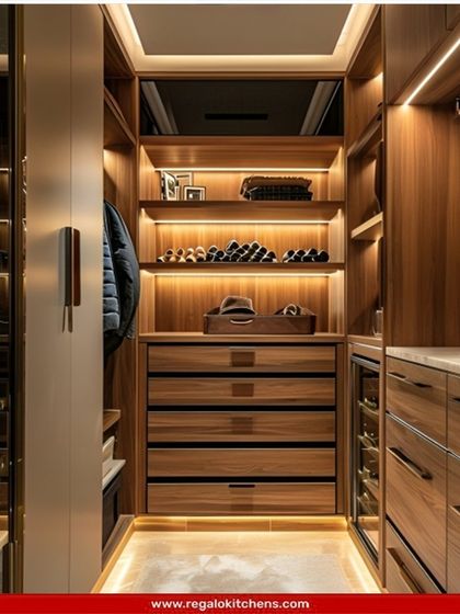 A compact walk-in closet featuring warm wood tones and integrated lighting. This design shows how even smaller spaces can be transformed into highly organized and beautiful storage areas.