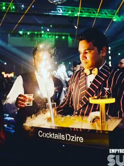 A tray of smoky cocktails ready to be served. We use dry ice and smoke guns to create a dramatic fog effect that rolls over the drinks and onto the table.