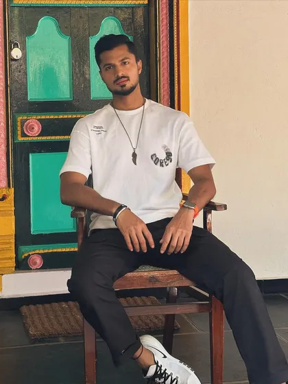 A seated pose that is both relaxed and composed.