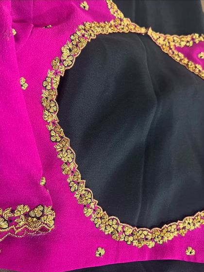 The back of the classic pink georgette blouse, featuring a simple round cutout framed with delicate gold hand embroidery.