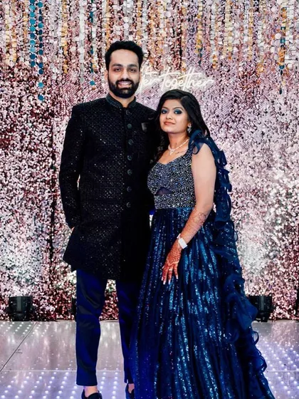 Bold, fearless, and beautiful. This couple looks stunning in their coordinated blue outfits for the sangeet night. Her makeup features a dramatic blue smokey eye.