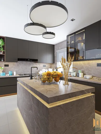 The kitchen is the heart of the home, and we design it with that in mind. For this project at Purva Smiling Willows, we performed major civil work to expand the space, adding a functional island counter. The entire kitchen, from the floor to the countertops, is finished in high-end imported granite for a seamless and luxurious feel.