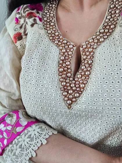 A close-up of the hand-embroidered pearl neckline on one of my Hakoba cotton kurtas. The combination of traditional Hakoba fabric with elegant pearl detailing creates a timeless and sophisticated look.