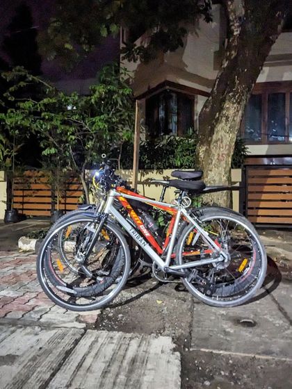 A stack of three bikes after our challenging ride to Koramangala. Even after a tough journey, we come together.