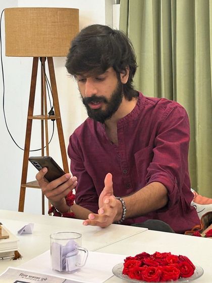 An artist passionately discusses a piece of literature during our "Guftugu" meetup.