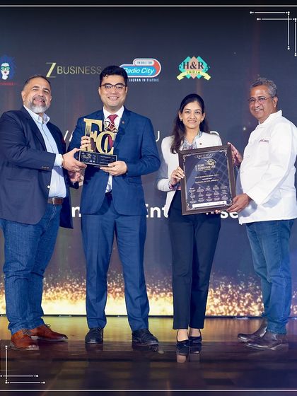 On stage receiving the Certificate of Excellence for "Most Innovative Menu" at the 9th Food Connoisseurs India Awards 2025. This award celebrates the creativity we pour into every menu.