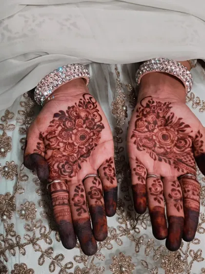 The final stain on this floral design is just beautiful. The dark, rich color on my friend's hands is the perfect result for any festive occasion.