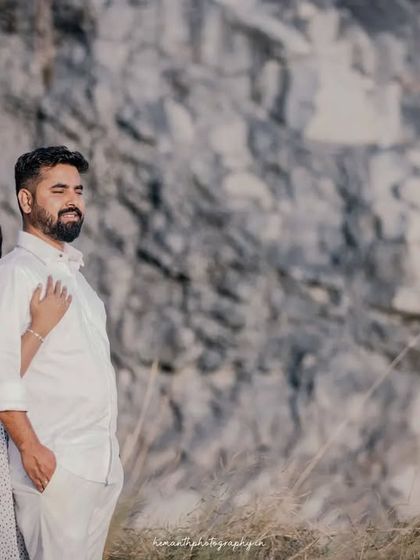 A serene moment captured during an outdoor maternity shoot, with the couple embracing and enjoying the peaceful surroundings.