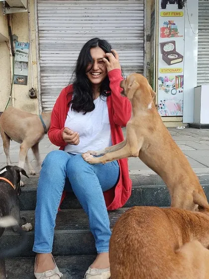 The best celebrations are the ones with dogs! Here I am, certificate in hand, getting lots of love from my furry friends on the street.