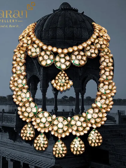 A grand and opulent bridal set featuring a layered polki necklace. This type of jewellery is perfect for creating a majestic bridal look that is rich in tradition and style.