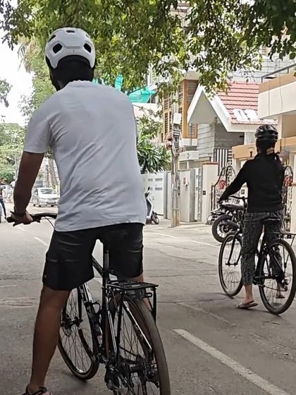 A view from behind shows our students practicing on the road. Everyone wears a helmet, which we provide, and we ensure the environment is safe for learning. This is the first step towards a lifetime of cycling adventures.