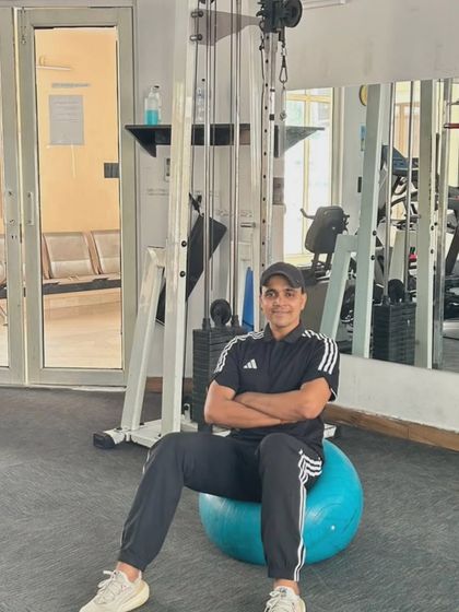 Relaxed but stable, demonstrating the core control developed through consistent training.